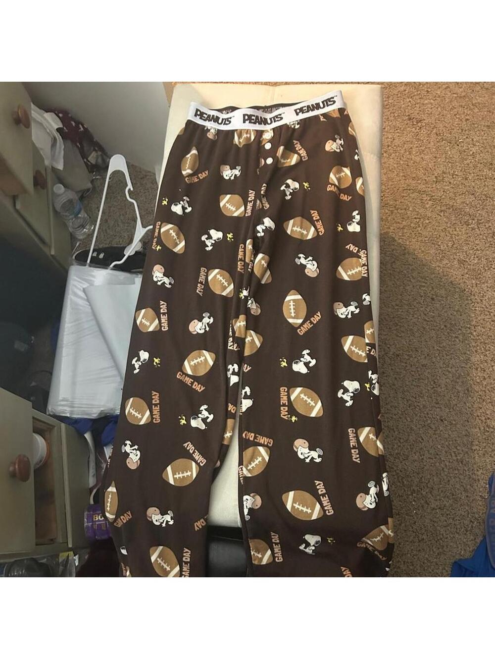 Brown Snoopy football pajamas with AOP footballs and 'GAME DAY' text, size M.